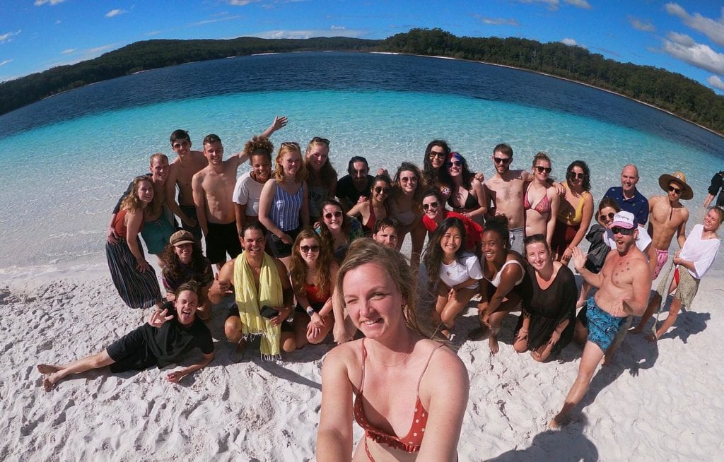 group of backpackers on fraser island, lake mckenzie